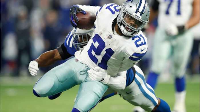 Ezekiel Elliott lunching forward against the Colts.